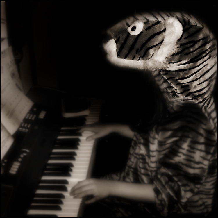 The Child Experiments with being a Tiger Playing a Piano