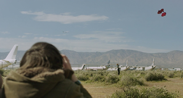 Aaron watches as Robin flies a kite