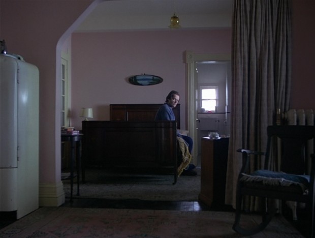 The Shining - Jack seated on the bed